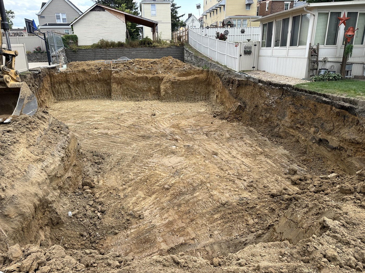 A lot excavated down to clay for a new basement