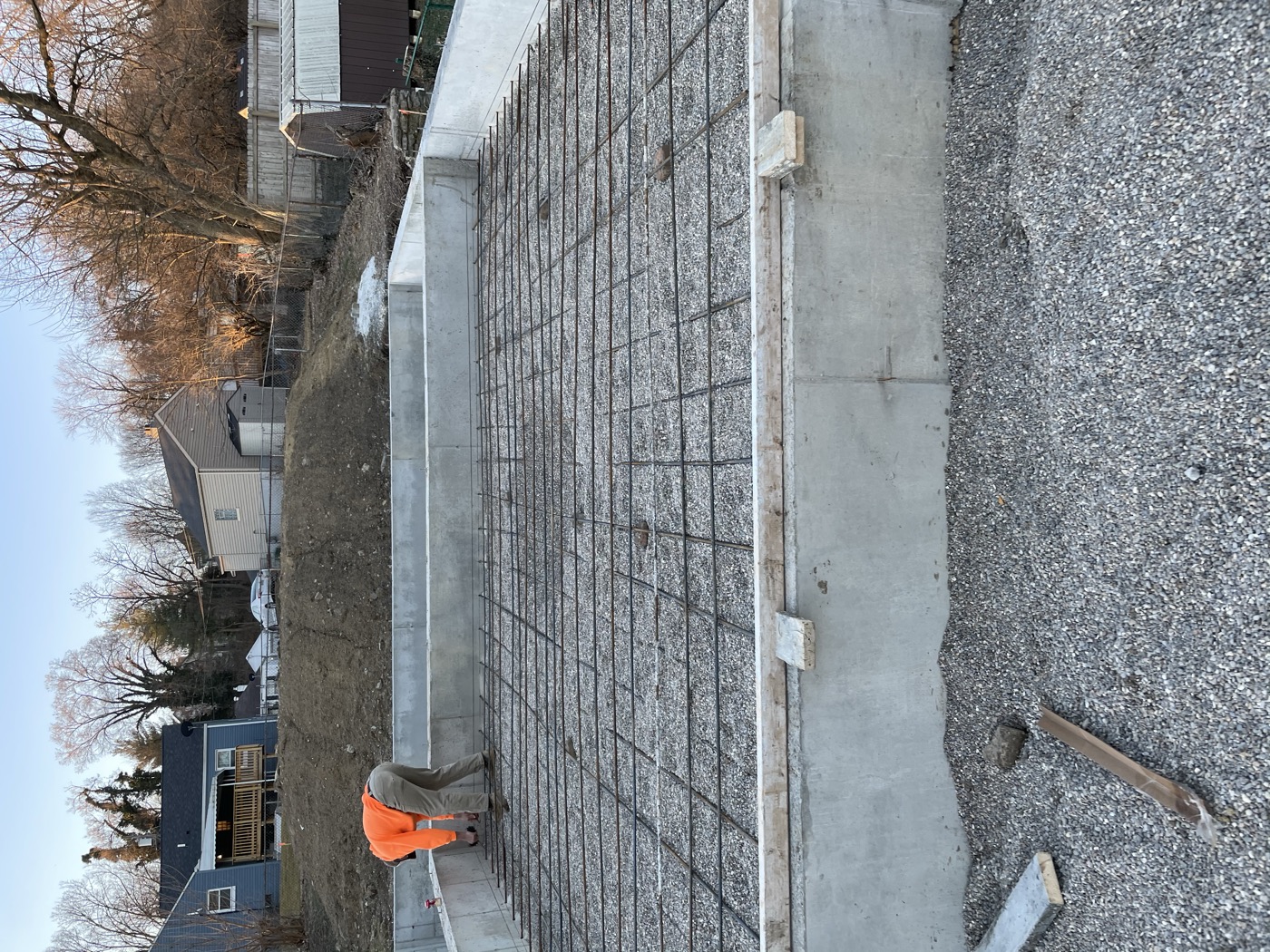 Rebar laid across a new basement before the slab pour