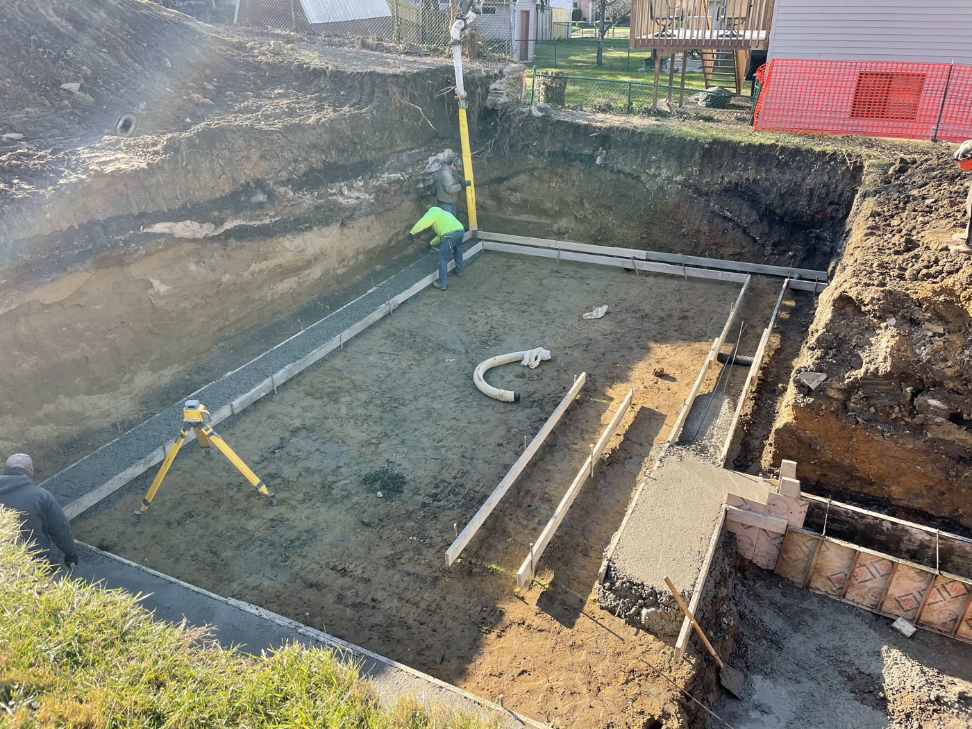 Footings and forms laid out in an excavated basement