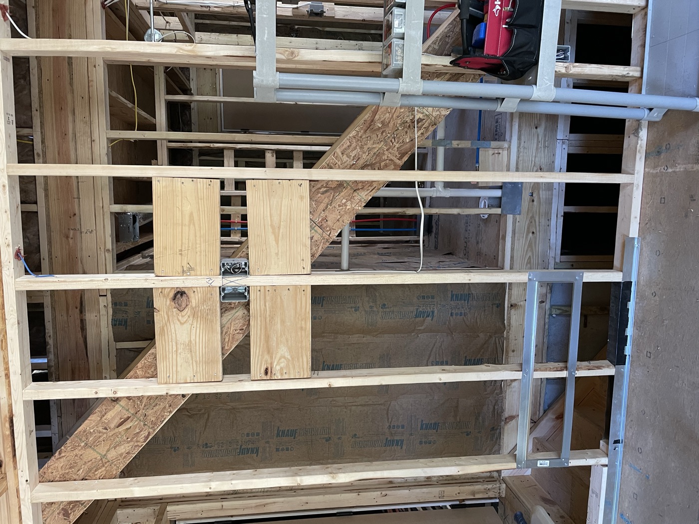 Interior wall framing and a window opening inside a new house