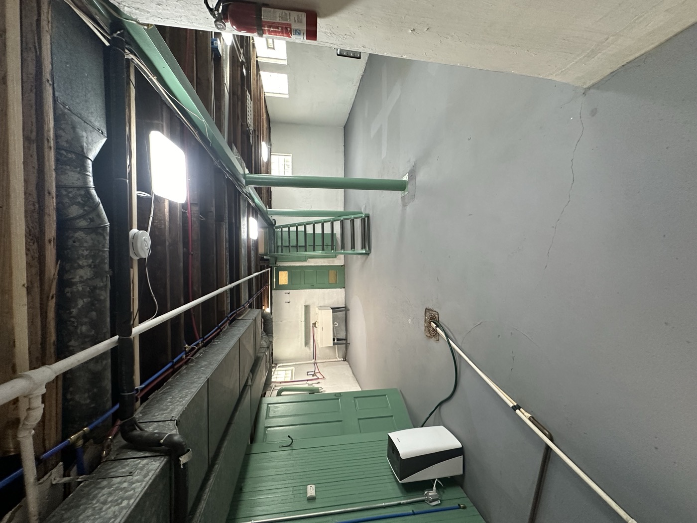 A large commercial basement space with painted walls