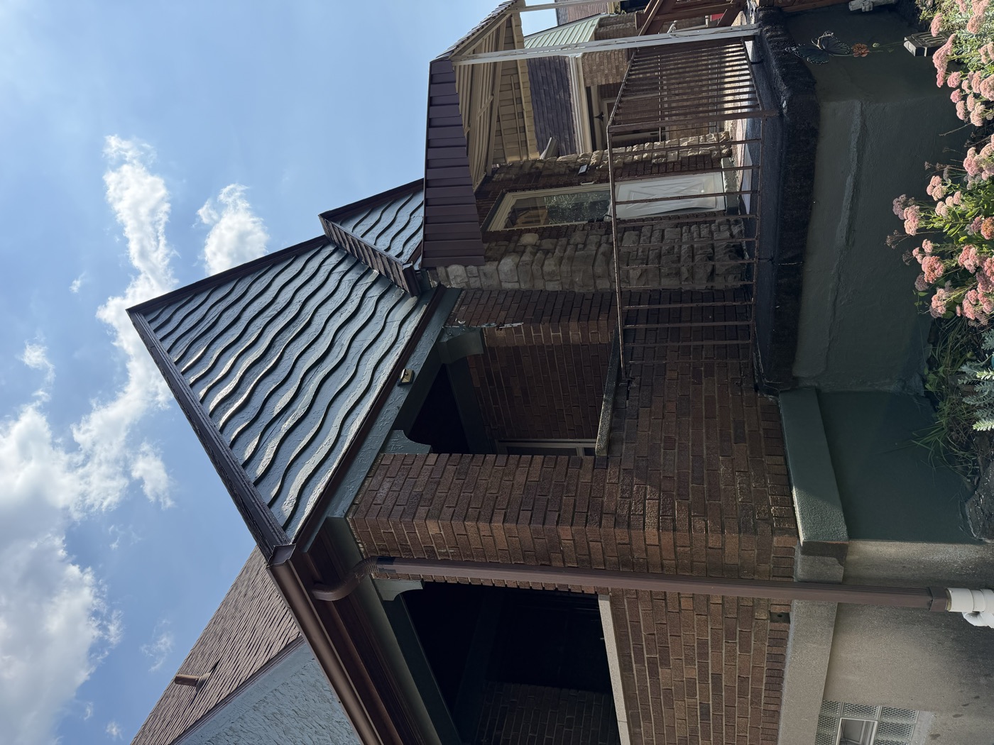 Close-up of a freshly painted gable and porch trim